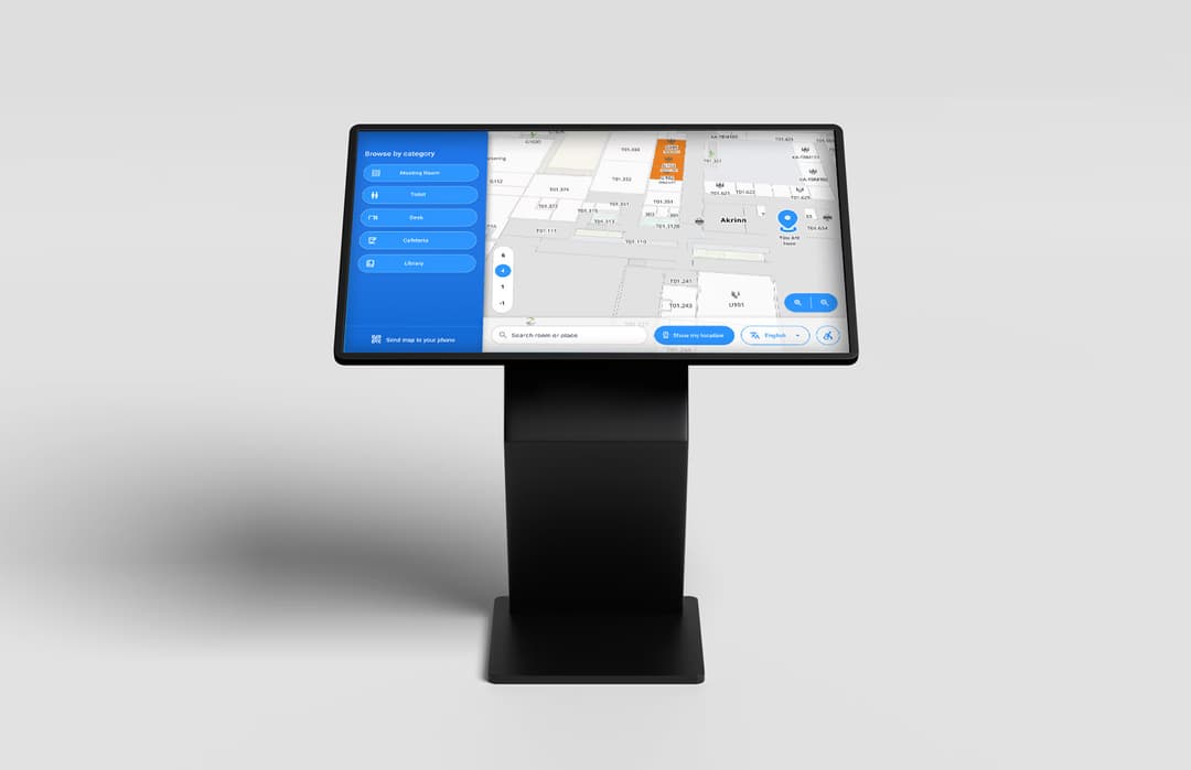 Wayfinding kiosk interface shown on a physical kiosk stand